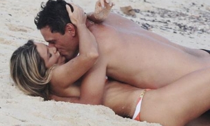 Rodrigo Lombardi dá beijão em Flávia Alessandra na praia