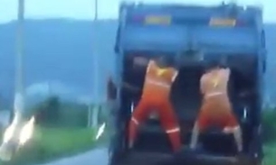 Catadores dançando lepo lepo em carro do lixo