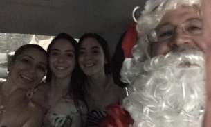 Papai Noel ‘resgata’ família que ficou ilhada após temporal